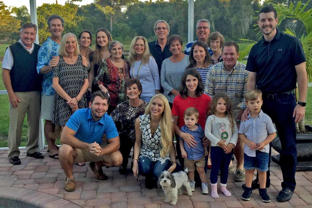 Photo of a large family outside.