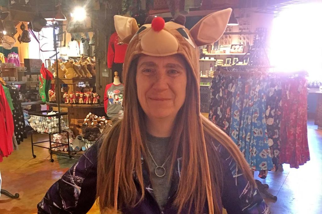 Missy Hill wearing a reindeer hat.