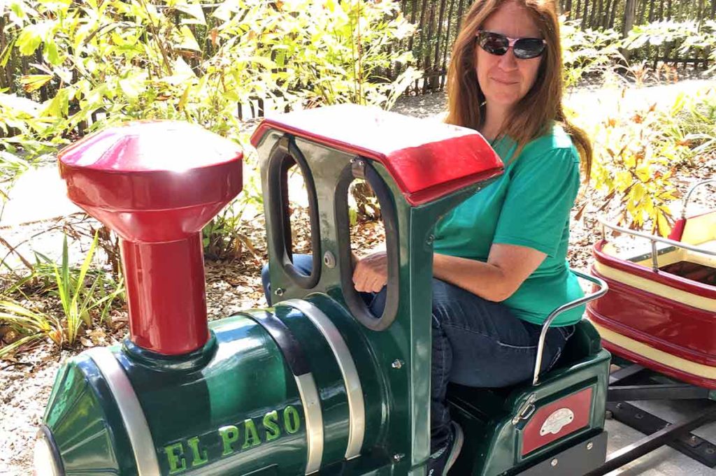 Missy Hill riding a small train.